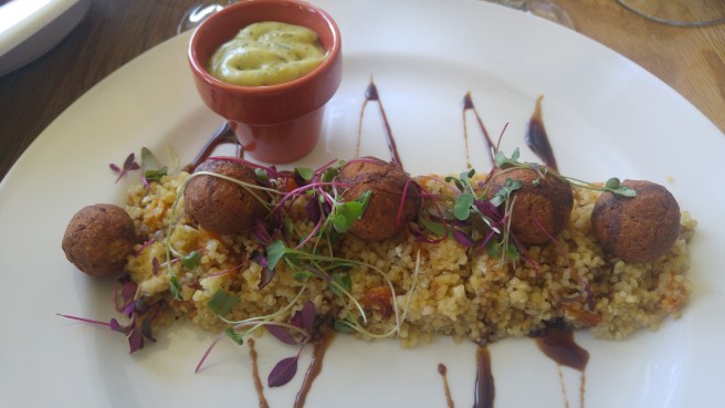 the quinoa and falafel salad with a blueberry sauce